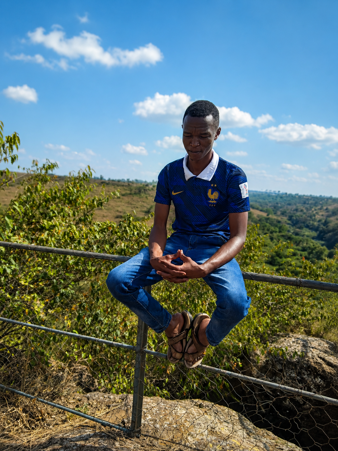 Spegieu sitting at a scenic overlook